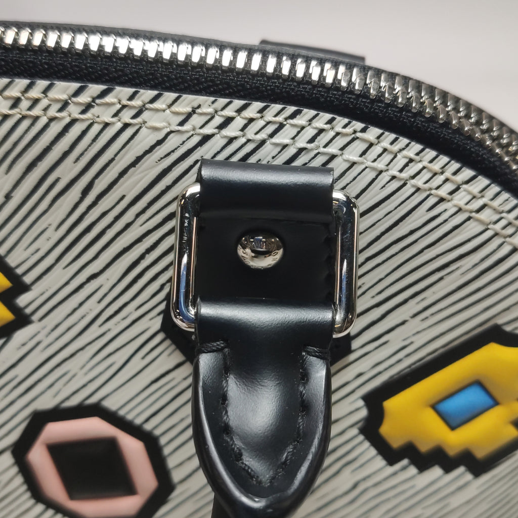 Louis Vuitton (LV) AlmaBB  bicolore con motivo Water Eave Emblem